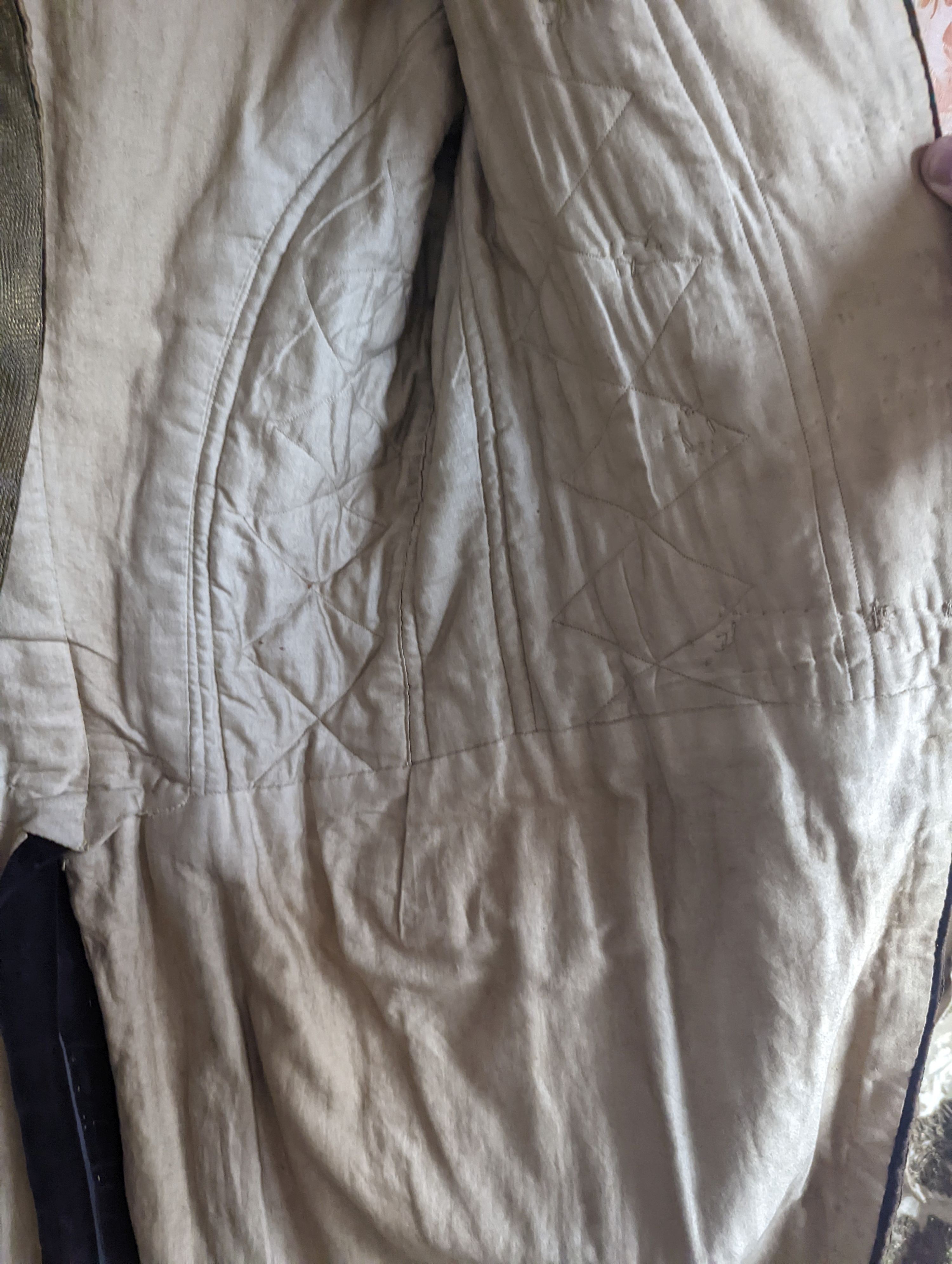 A Georgian gents cream damask waistcoat, a similar waistcoat with beading applied later and a velvet and gold braided tailcoat